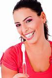 beautiful young woman holding tooth brush and smiling