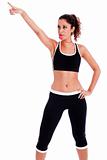 Young fitness woman pointing up the right corner