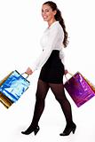 Full length shot of young woman holding shopping bag