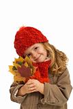 Little girl holding autumn leaves