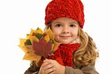 Little girl portrait with autumn leaves