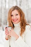 A beautiful caucasian girl drinking hot coffee