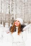 Woman wearing white in snowy woods