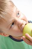 boy biting an apple