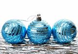 Christmas holiday  tinsel with blue balls isolated on white