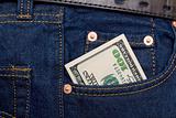Hundred dollars banknotes in rocket of blue jeans