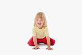 boy with long blond hair sitting, looking at camera - clipping path