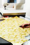 cutting the yellow silk cloth