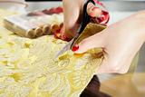 cutting the yellow silk cloth