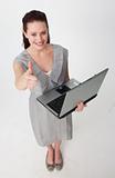 High angle of a businesswoman using a laptop with thumb up