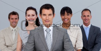 Positive multi-ethnic business team in front of the camera
