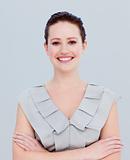Portrait of a smiling beautiful businesswoman with folded arms