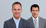 Portrait of smiling businessmen with folded arms