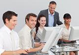 Multi-ethnic business people working with computers in an office