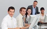 Multi-ethnic business team working with computers in an office