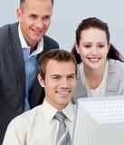 Portrait of business people working together with a computer