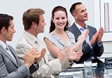 Attractive businesswoman applauding in a meeting