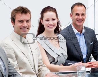 Portrait of business people sitting in a meeting