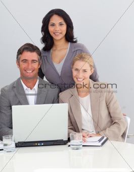 Smiling business team working in the office