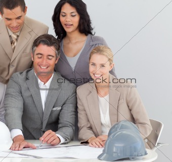 Enginners studying plans in the office
