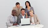Multi-ethnic business team studying sales figures