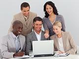 Multi-ethnic business team working in office together