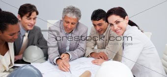 Architectural multi-ethnic business team working in the office