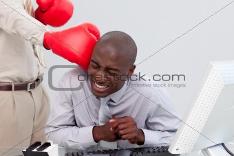 Afro-American businessman being boxed