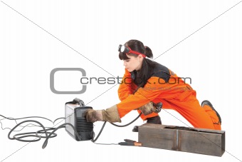 Girl adjusts plasma cutter.