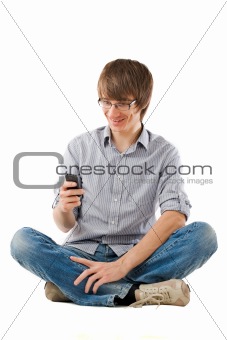 Young man using mobile phone for sms