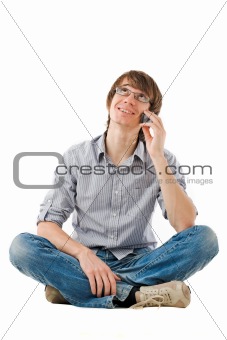 Young man talking by mobile phone