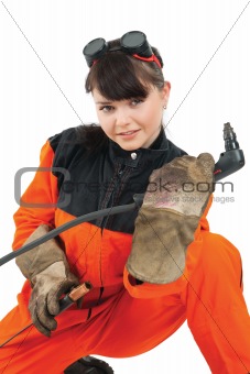 Girl welder working with burner