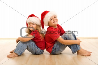 Happy christmas kids sitting on the floor