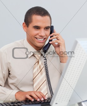 Businessman talking on phone in the office