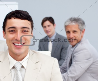 Portrait of a smiling businessman in a meeting