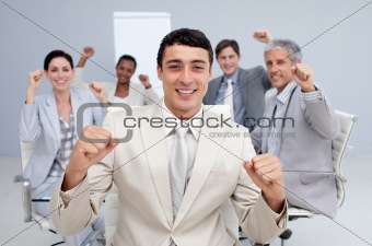 Happy business team celebrating a sucess
