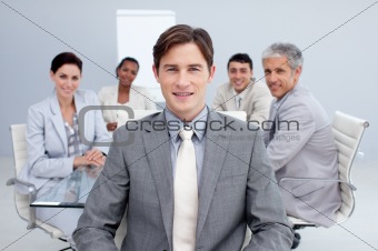 Attractive businessman smiling in a meeting