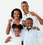 Afro-american family brushing their teeth
