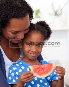 Portrait of a smiling girl eating fruit 