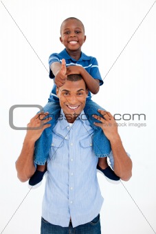 Happy father giving son piggyback ride