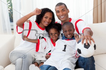 Afro-American family celebrating a football goal