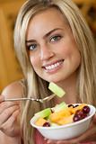 Woman Eating Fruit Salad
