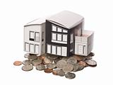 House model standing on american coins