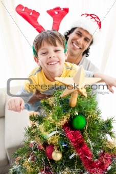 Portrait of a smiling father and child at Christmas time