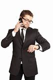 Businessman in a suit talking on the phone. Isolated over white