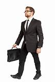 Business man in a suit and sunglasses comes with a briefcase