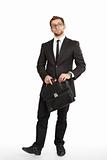 Business man in suit and glasses standing with a briefcase and t