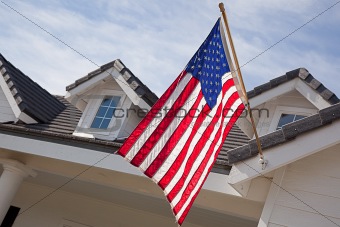 Abstract House Facade & American Flag Against a Blue Sky