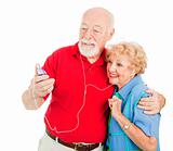 Senior Couple Listening to MP3s