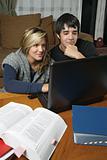 Students doing homework with laptop